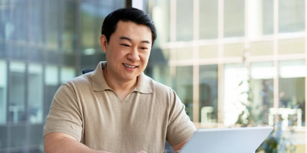 Business professional wearing moisture wicking polo shirts Dubai, ideal for office wear with all-day comfort and style.