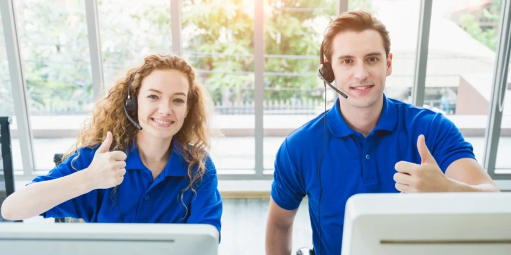 Customer support team wearing moisture wicking polo shirts Dubai, professional uniforms designed for comfort and long work hours.